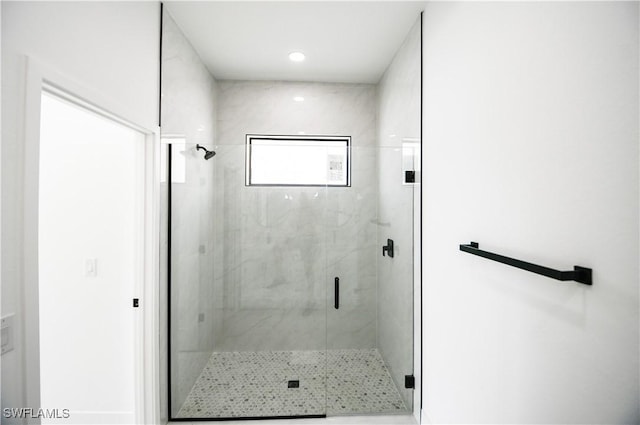 bathroom featuring a shower stall