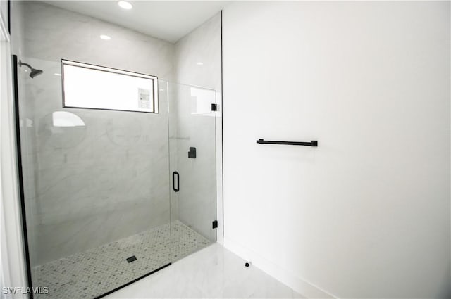 full bathroom featuring recessed lighting and a shower stall