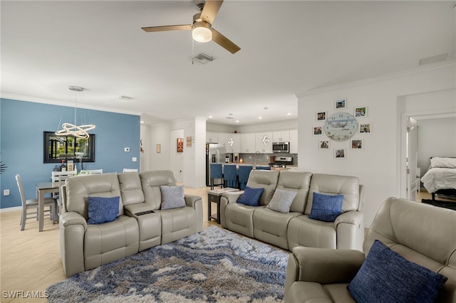 living room featuring light tile patterned floors, ceiling fan, visible vents, and crown molding