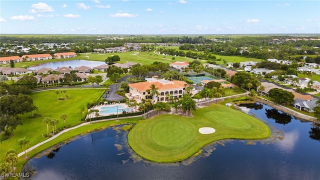 birds eye view of property featuring golf course view, a water view, and a residential view