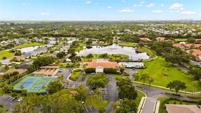 drone / aerial view featuring a water view and a residential view