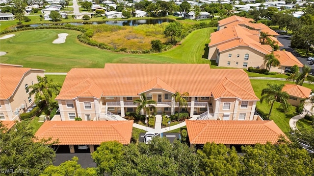 bird's eye view featuring a water view, a residential view, and golf course view