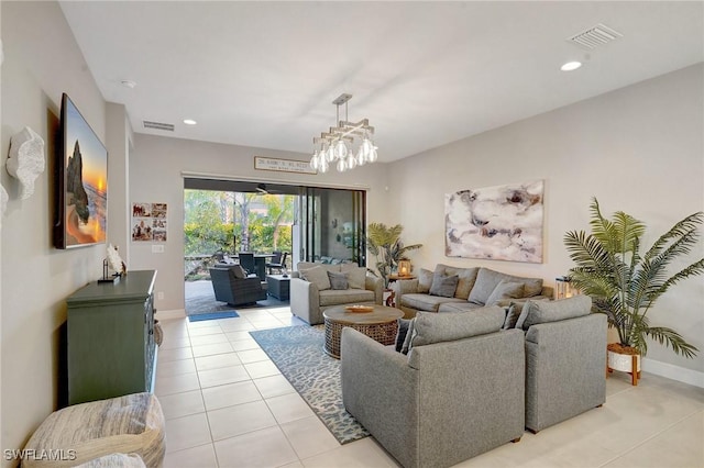 living room featuring light tile patterned floors, baseboards, visible vents, a notable chandelier, and recessed lighting