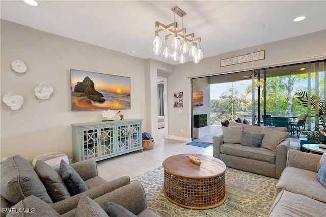 living room with a chandelier, recessed lighting, baseboards, and tile patterned floors