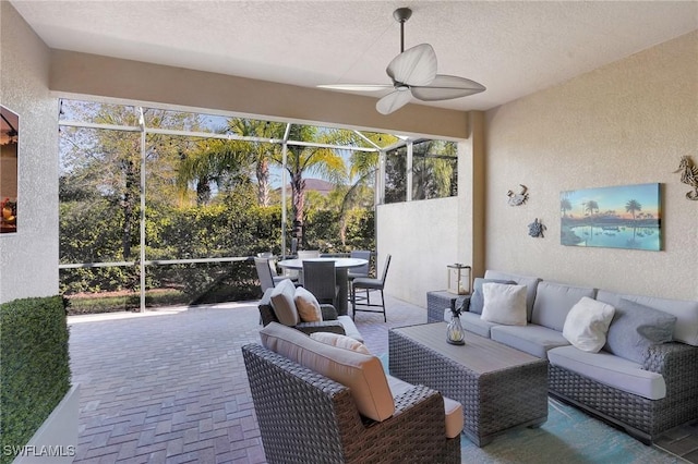 sunroom / solarium with ceiling fan