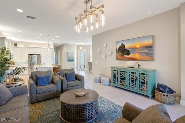 living room featuring light tile patterned floors, baseboards, visible vents, and recessed lighting