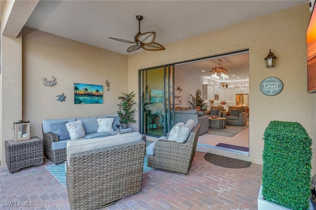 view of patio / terrace featuring ceiling fan and an outdoor living space