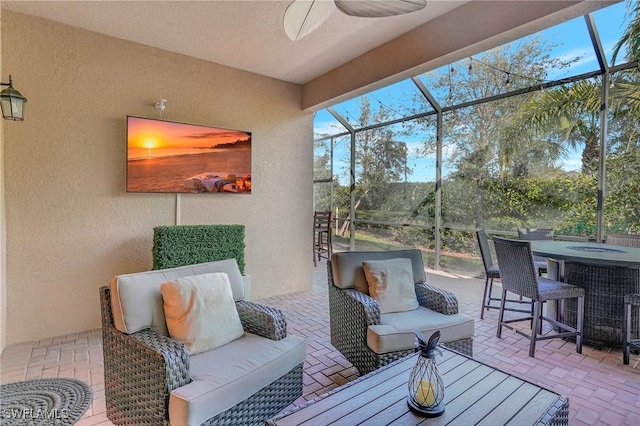 sunroom / solarium with ceiling fan