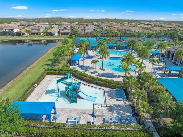 birds eye view of property with a water view and a residential view