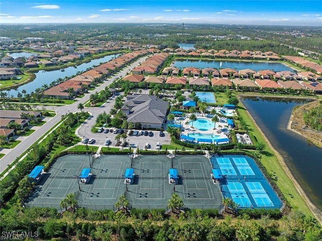 drone / aerial view with a water view and a residential view