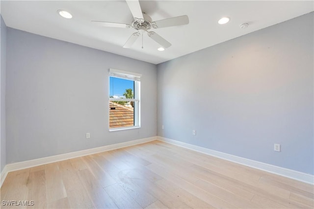 spare room featuring ceiling fan, light wood finished floors, recessed lighting, and baseboards