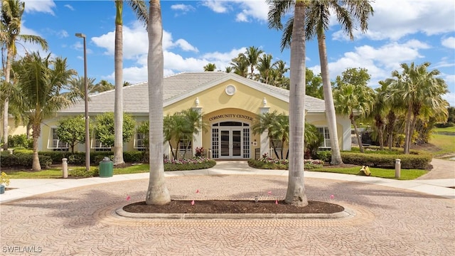 view of property with curved driveway