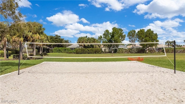 view of community featuring a lawn and volleyball court