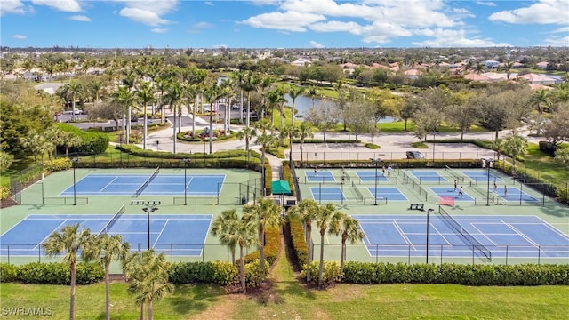 view of sport court featuring a water view