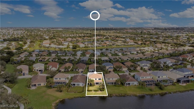 aerial view with a water view and a residential view