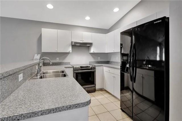 kitchen featuring white cabinets, under cabinet range hood, light countertops, stainless steel range with electric stovetop, and a sink