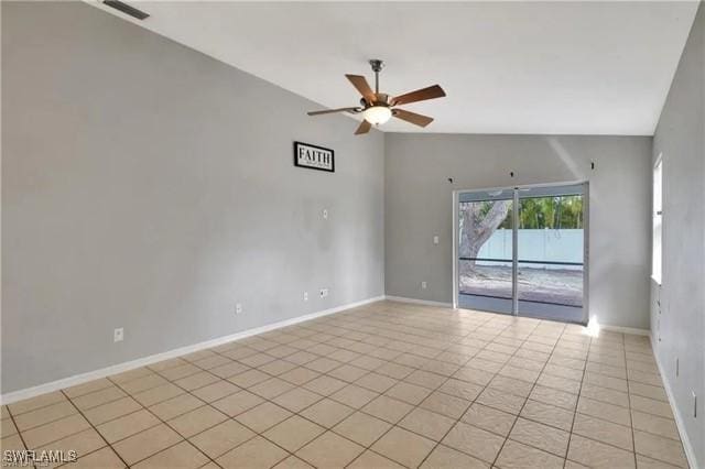 unfurnished room featuring light tile patterned floors, baseboards, visible vents, a ceiling fan, and vaulted ceiling