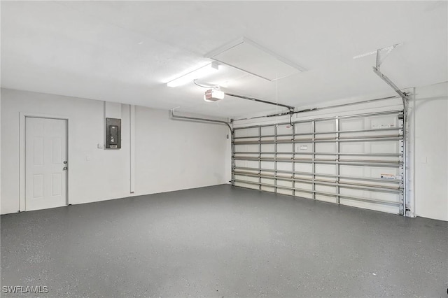 garage featuring electric panel and a garage door opener