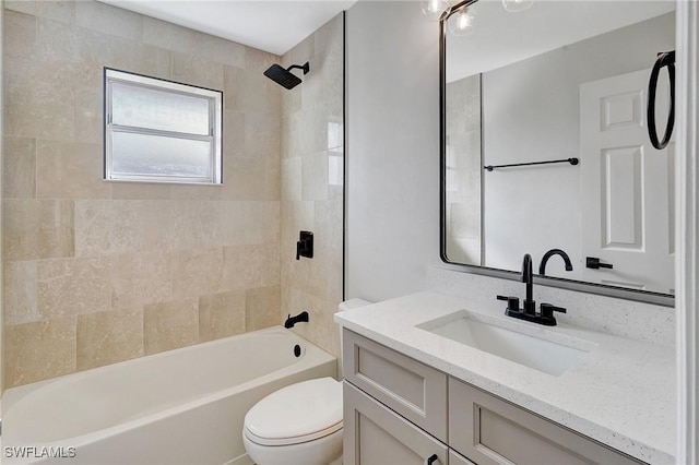 full bathroom featuring toilet, tub / shower combination, and vanity