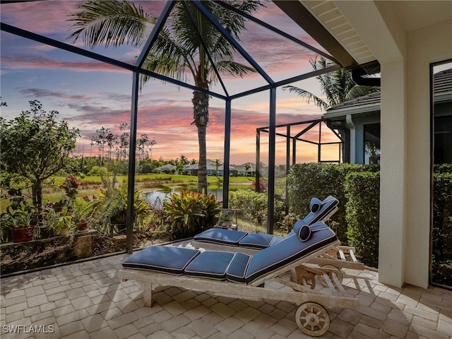 patio terrace at dusk with glass enclosure