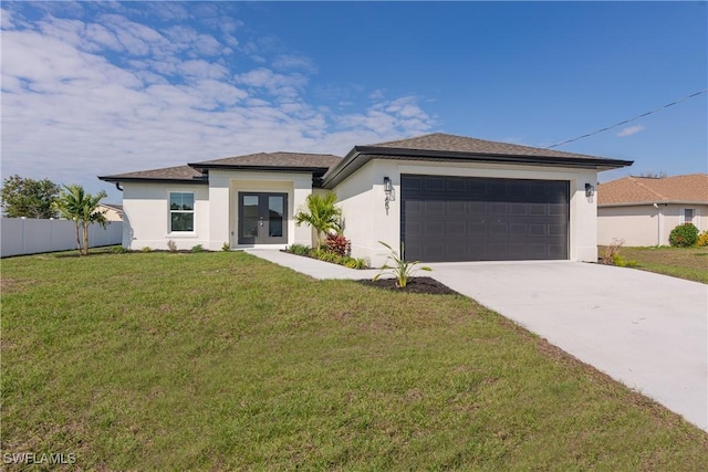 prairie-style house with stucco siding, concrete driveway, a front yard, fence, and a garage