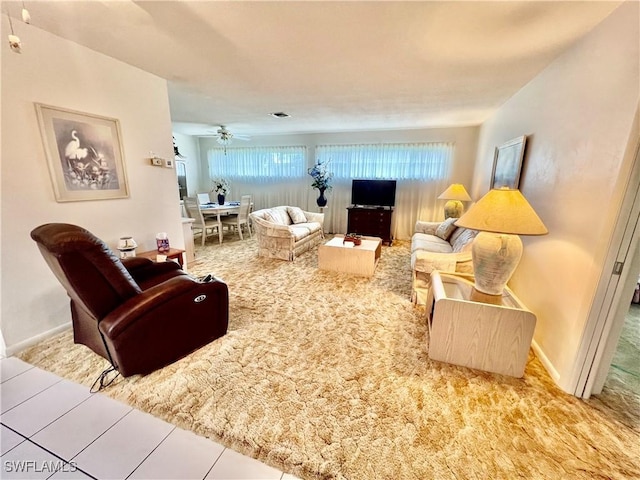 living area featuring visible vents and baseboards