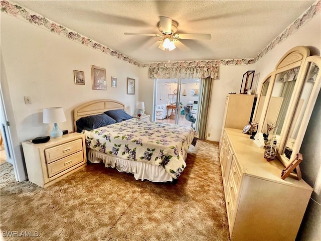 bedroom with access to outside, a ceiling fan, a textured ceiling, and carpet flooring