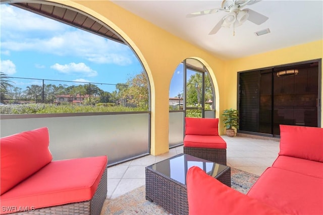 view of patio / terrace featuring a ceiling fan, visible vents, and an outdoor living space