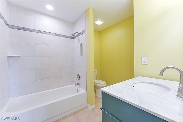 bathroom with tile patterned flooring, shower / bath combination, vanity, and toilet