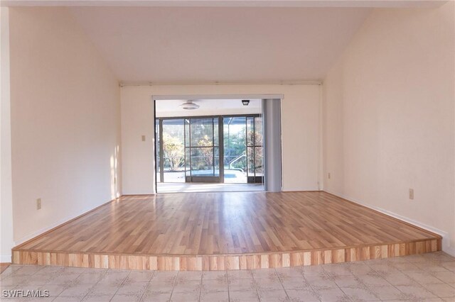 spare room featuring wood finished floors