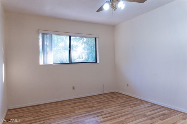 unfurnished room featuring baseboards, ceiling fan, and light wood-style floors