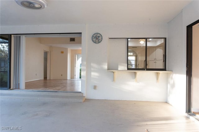 spare room with a healthy amount of sunlight and visible vents