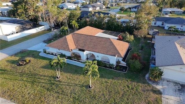 birds eye view of property with a residential view