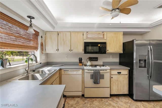 kitchen featuring white appliances, a sink, and light brown cabinetry