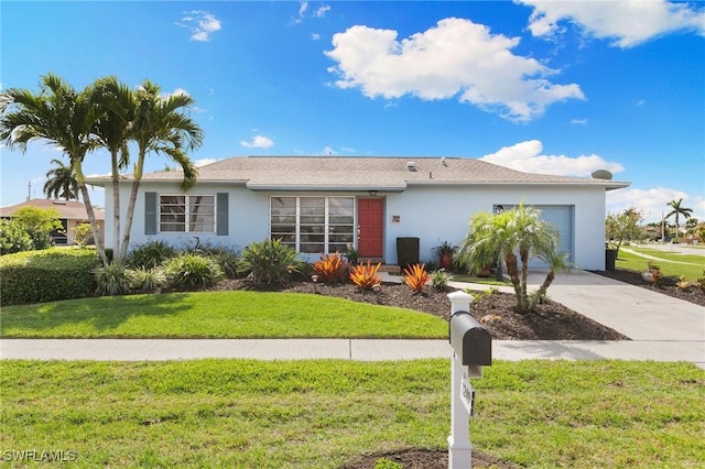 single story home featuring concrete driveway, stucco siding, an attached garage, and a front yard