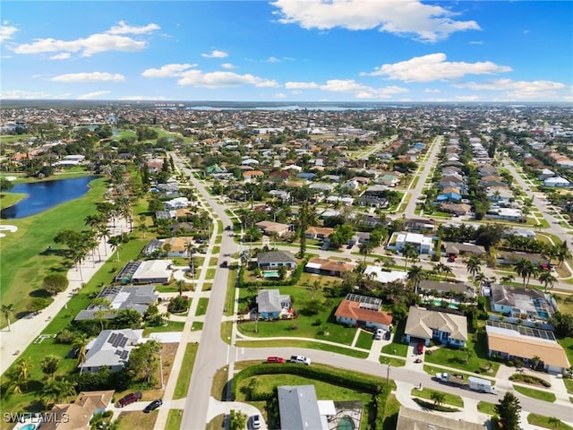 drone / aerial view featuring a water view and a residential view