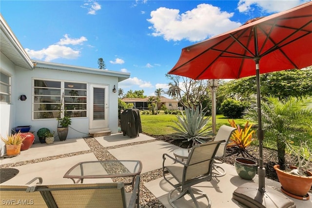 view of patio with a grill