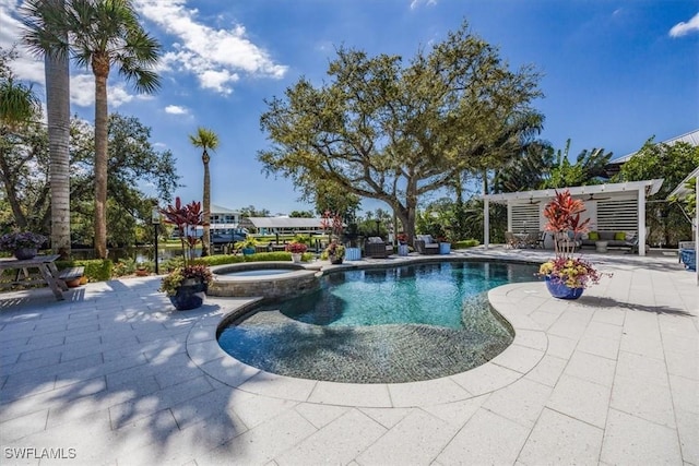 view of swimming pool with a pool with connected hot tub and a patio