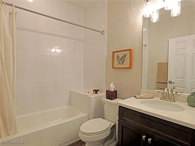 bathroom featuring shower / tub combo, vanity, and toilet