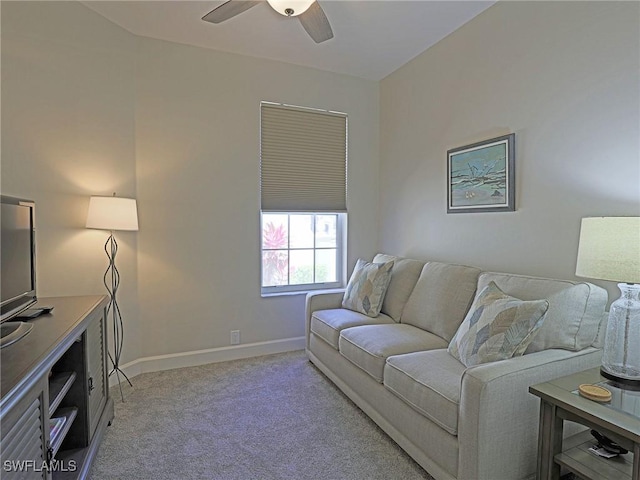 living room with light carpet, ceiling fan, and baseboards