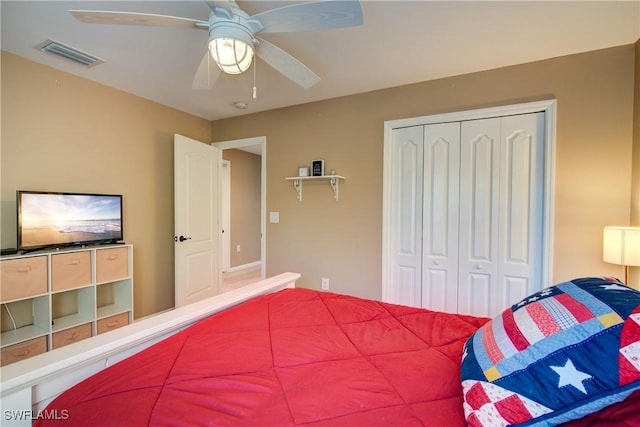 bedroom with a closet, visible vents, and a ceiling fan