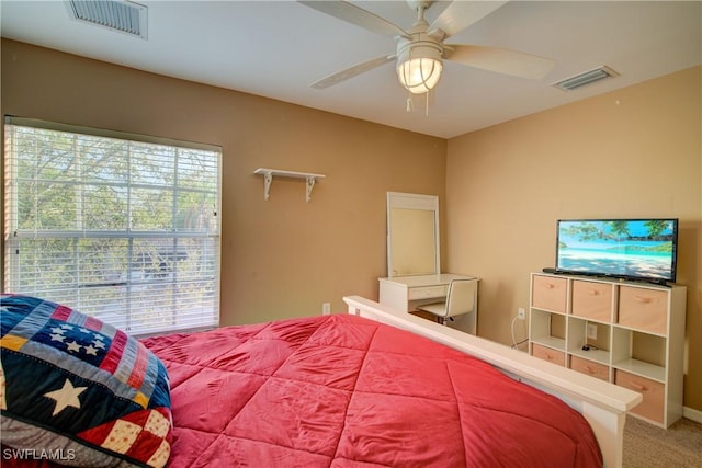 carpeted bedroom featuring visible vents and ceiling fan