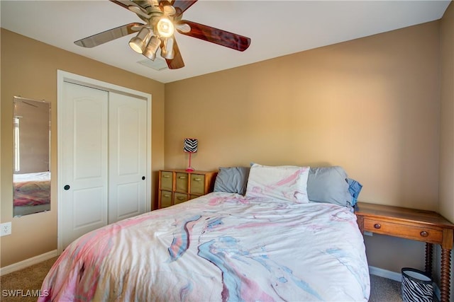 bedroom featuring a closet, carpet floors, and baseboards