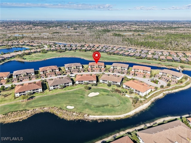 birds eye view of property featuring a residential view, view of golf course, and a water view