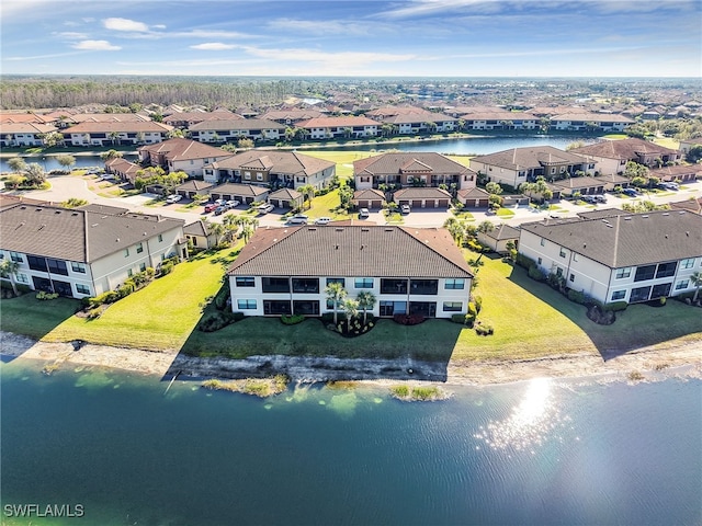 bird's eye view featuring a water view and a residential view