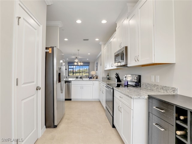 kitchen featuring appliances with stainless steel finishes, recessed lighting, white cabinets, and light tile patterned floors