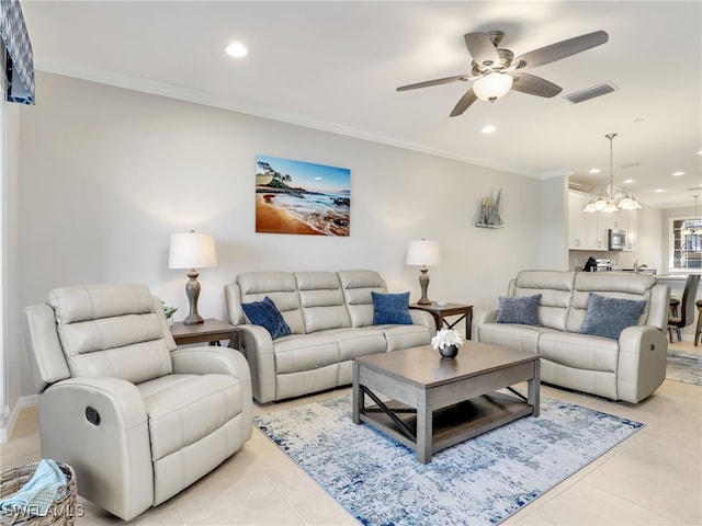 living area with light tile patterned flooring, recessed lighting, visible vents, and crown molding