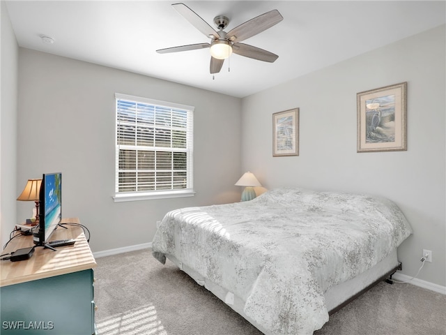 bedroom with carpet, ceiling fan, and baseboards