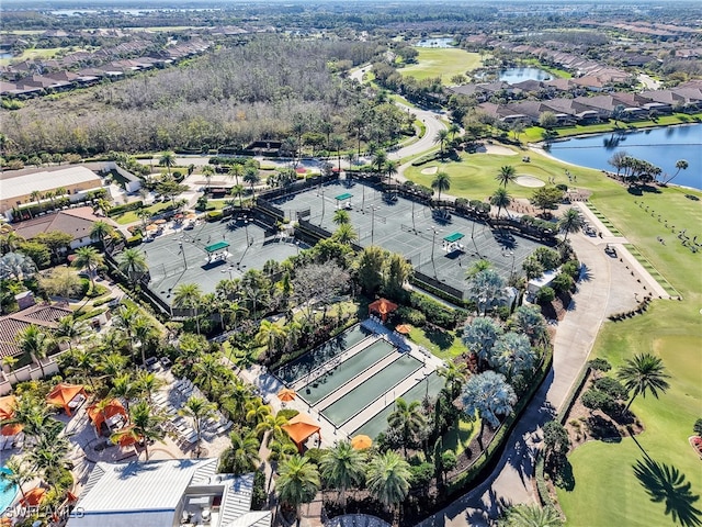 bird's eye view featuring golf course view, a water view, and a residential view