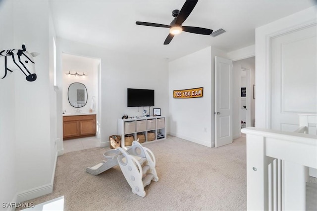 bedroom featuring light carpet, visible vents, a ceiling fan, and baseboards